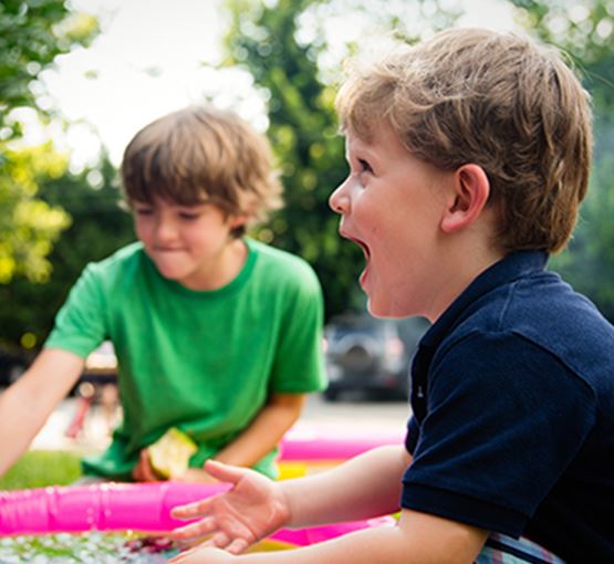 Two kids playing in a park